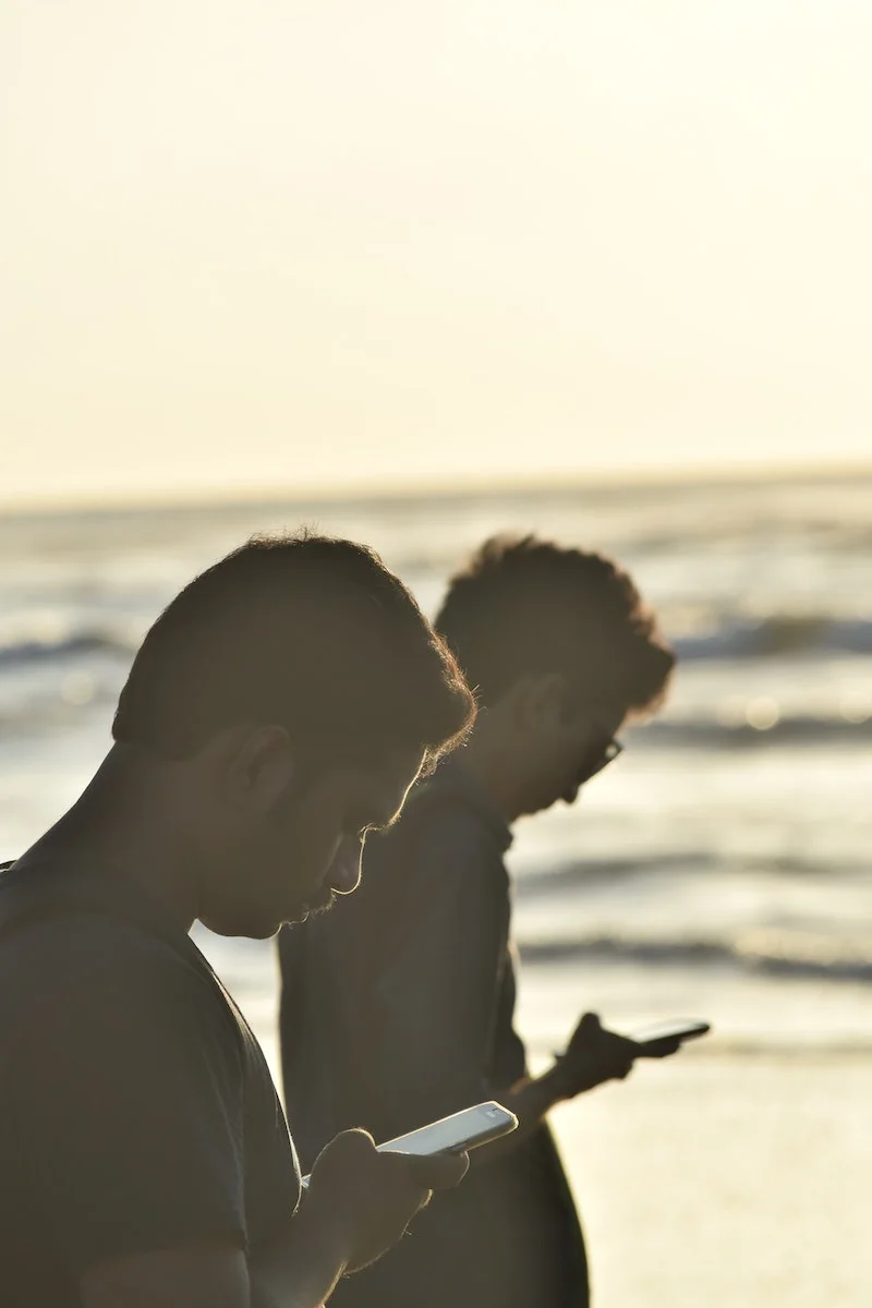 how often should I text my crush - glued to his phone