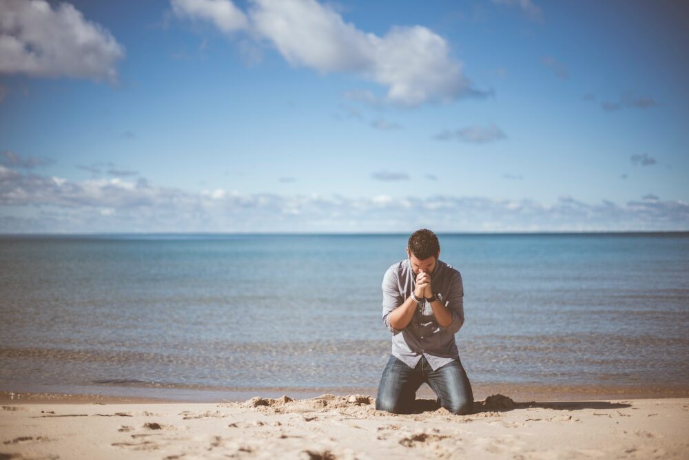 man praying for a girl to contact him again